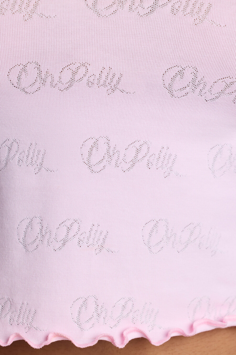 shorts curtos de cintura média com detalhes em ponto ajour na cor rosa bebê.